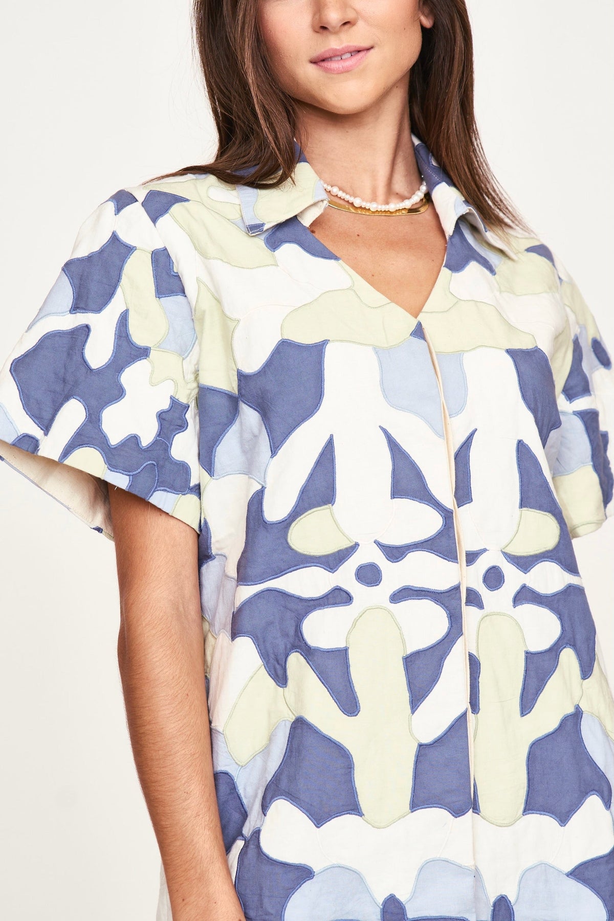 Dress in covered front button placket