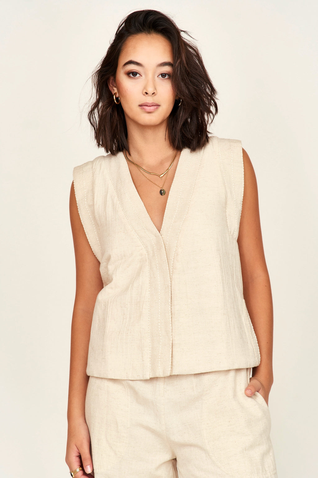Lightly quilted vest with tie belt