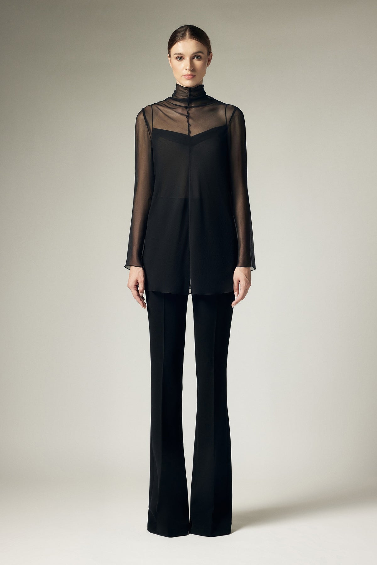 High neck long sleeved shirt with vest underneath