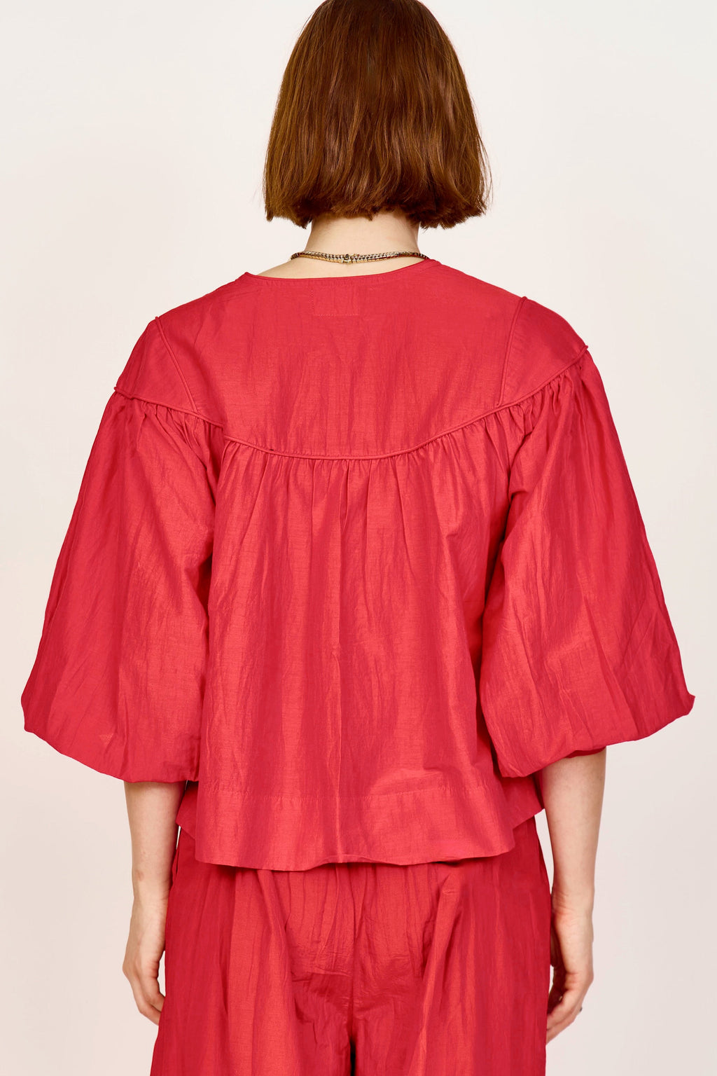 Gathered blouse with front half placket